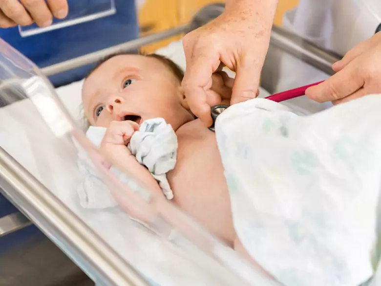 A tooth in a newborn baby and the need to remove it
