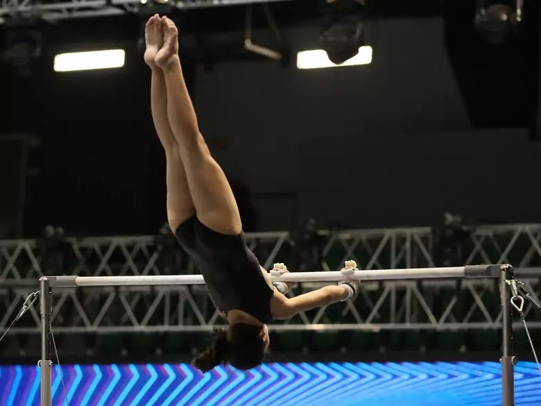 What are the benefits of practising artistic gymnastics?