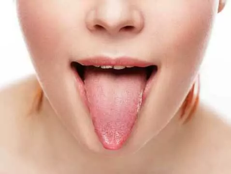 What could be the causes of tongue pain?