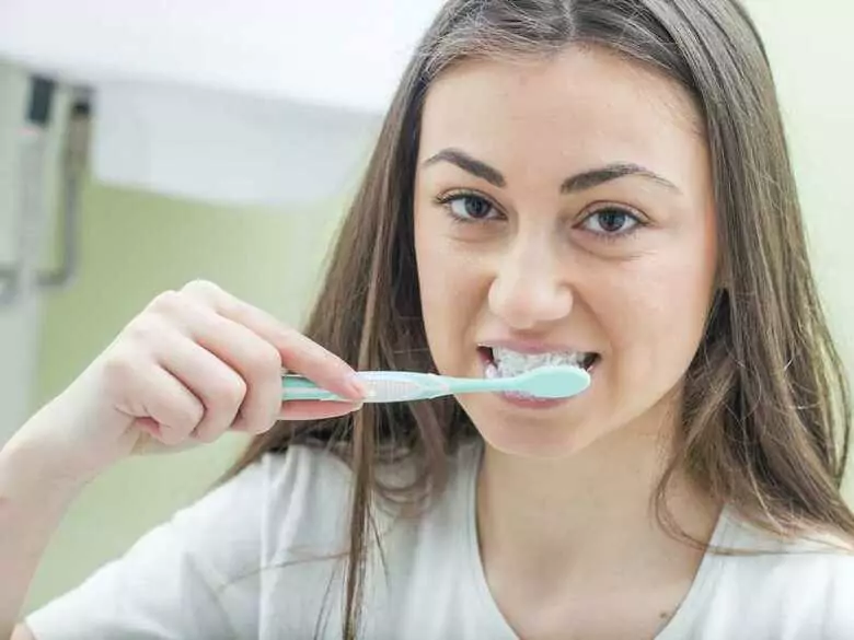 How often should I brush my teeth?