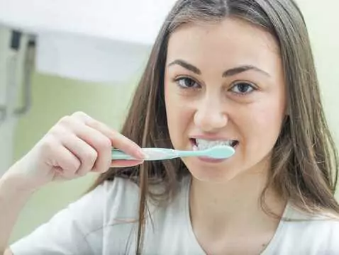 How often should I brush my teeth?